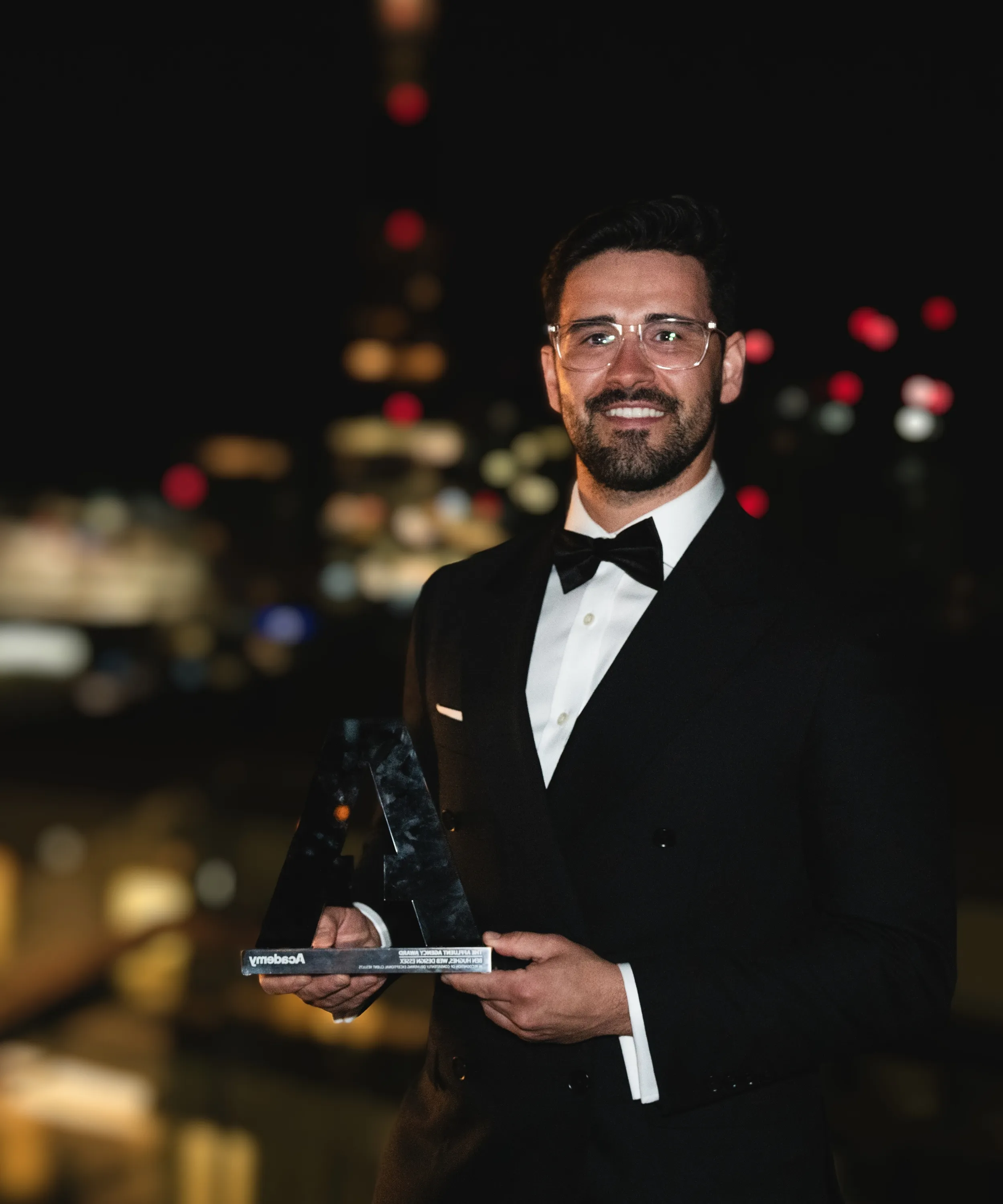 Ben Hughes, founder of SEO Essex, receiving an award for outstanding SEO results at the 2025 business awards ceremony